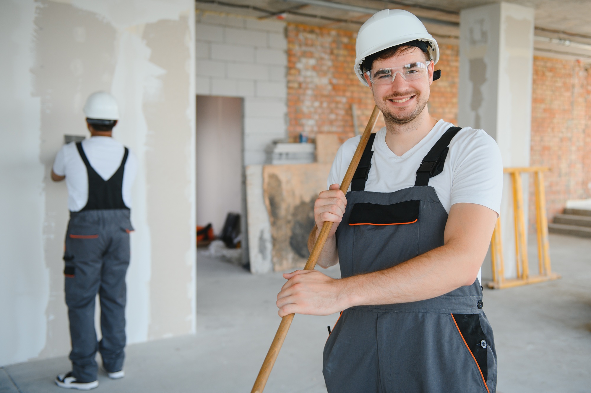 painter man painting the wall, with paint roller